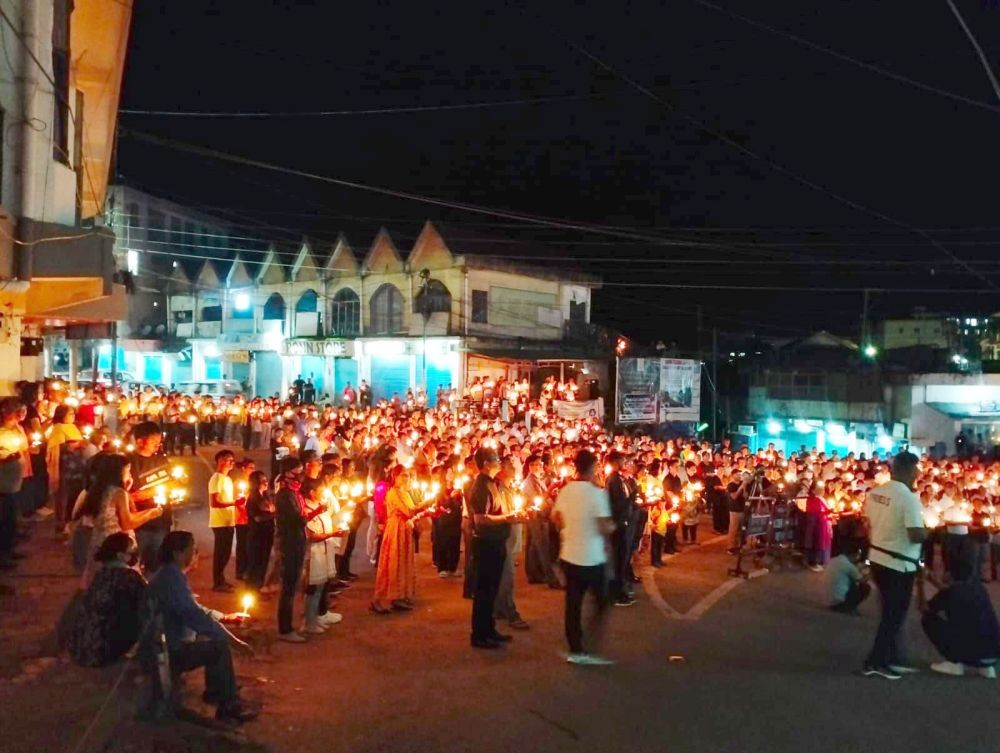 Hundreds of people participated in the candlelight vigil organised by the ABAM in Mokokchung on July 9.